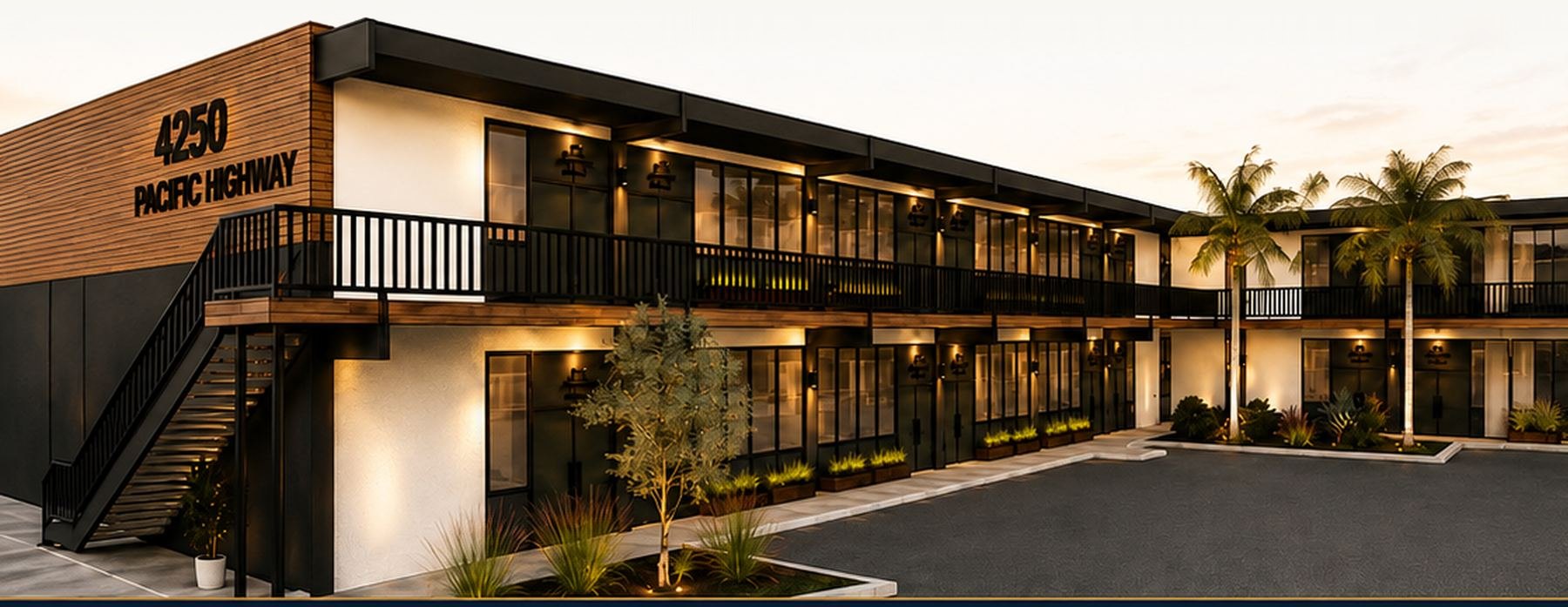 Rendering of 4250 Pacific Highway — a renovated two-story office building at dusk with palm trees and on-site parking